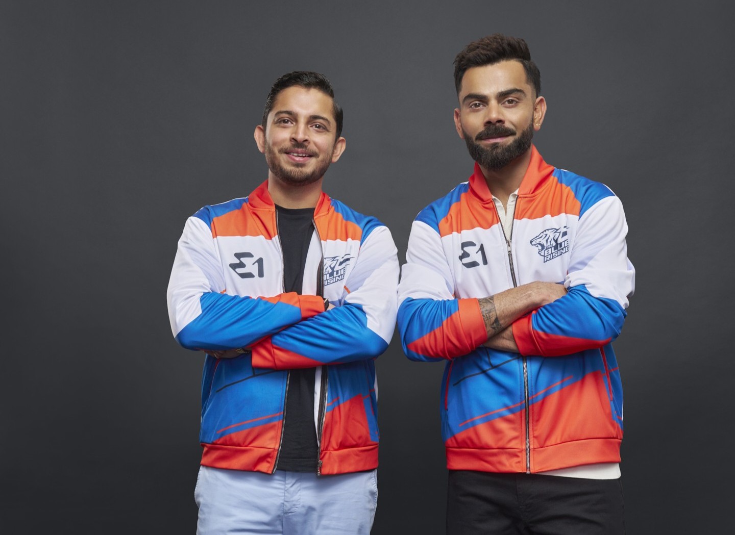Virat Kohli with Team Blue Rising representative in E1 team jackets