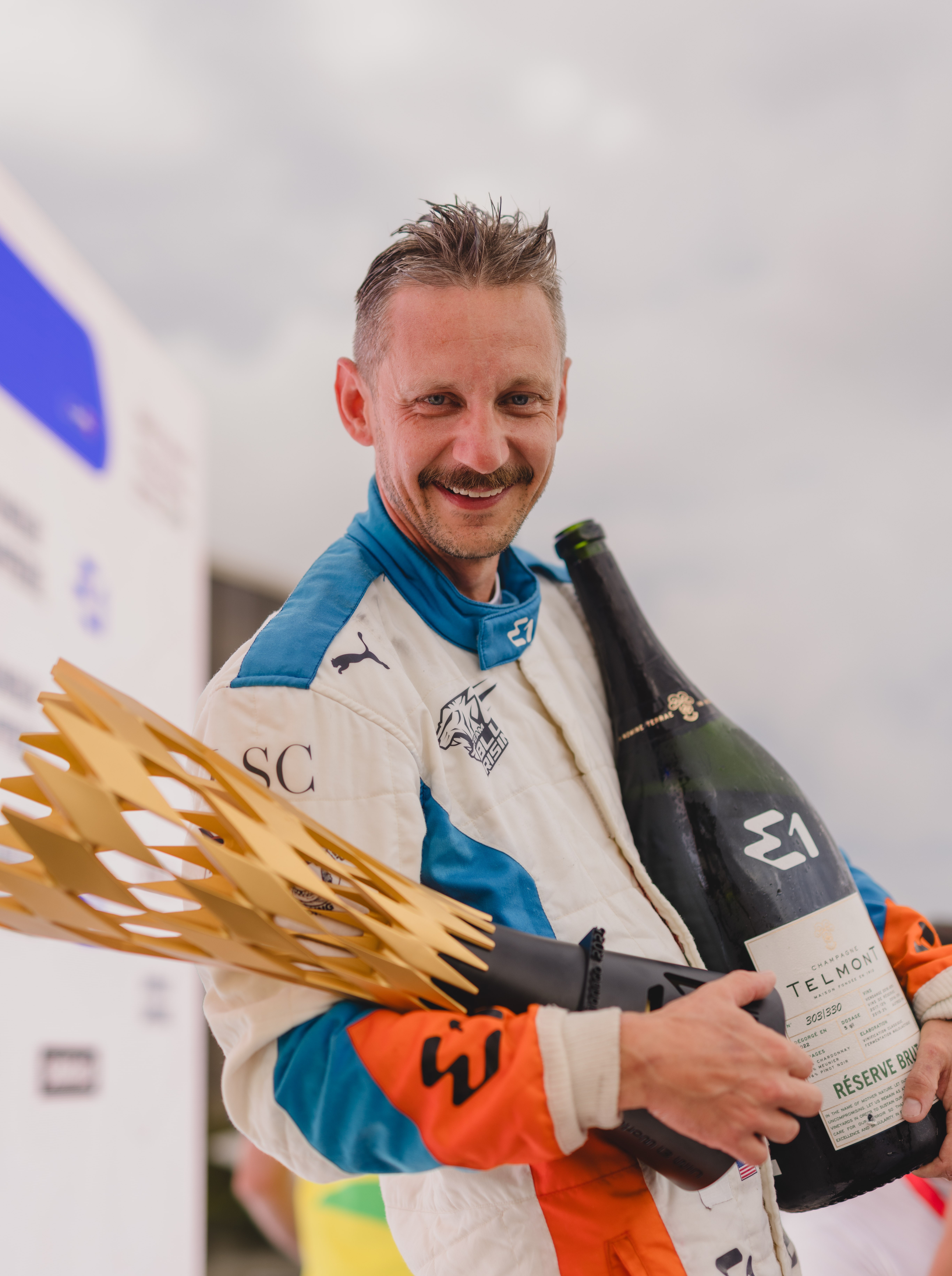 Monaco GP P1 celebration with E1 trophy and Telmont champagne