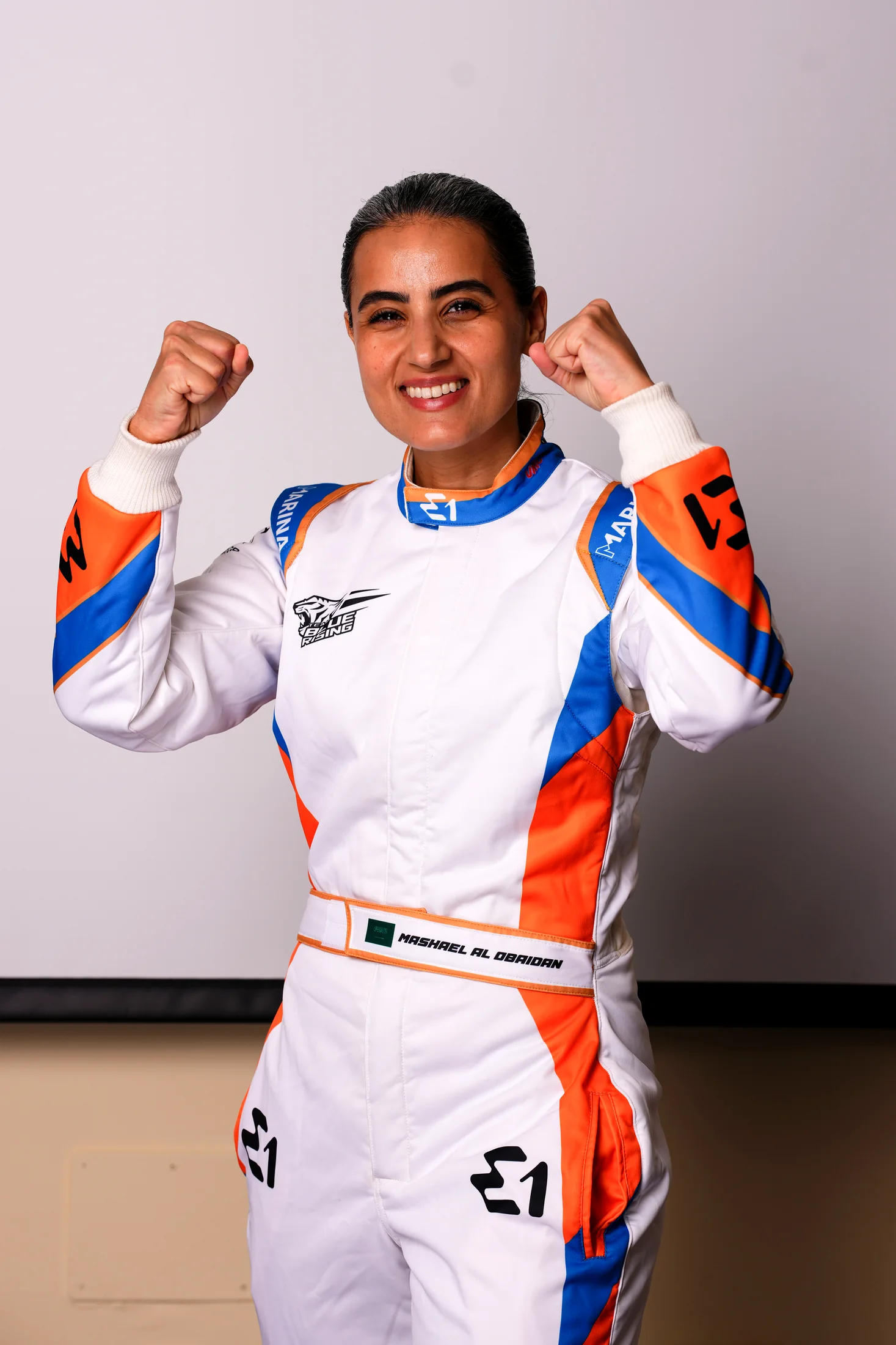 Mashael Al Obaidan in Team Blue Rising race suit