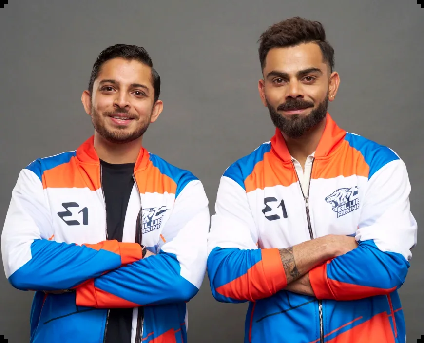 Virat Kohli and Adi Mishra in Team Blue Rising kit