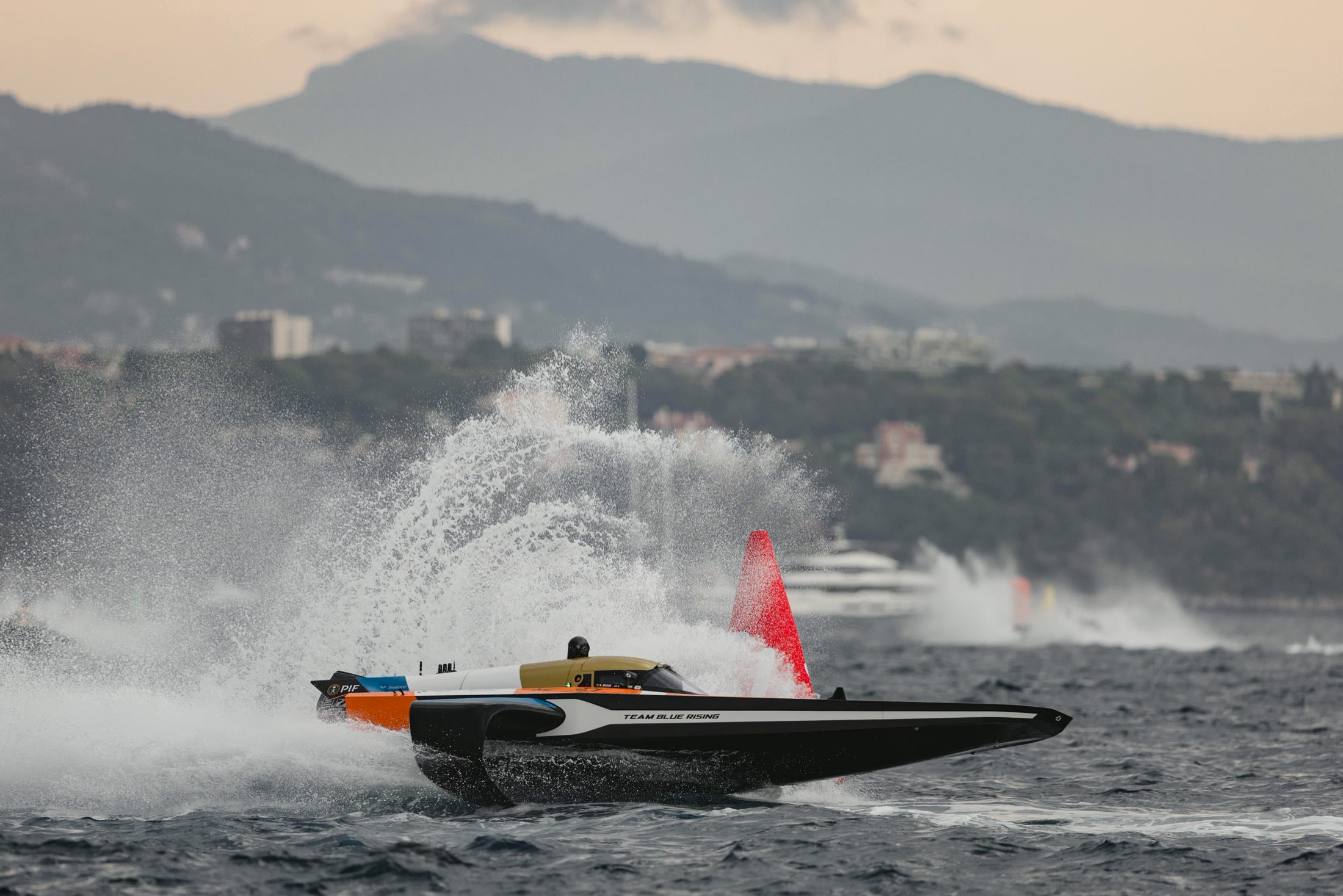 RaceBird cutting through spray on the water